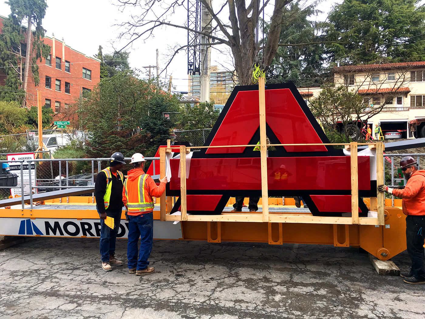 Mounting an Anderson Construction logo on a crane