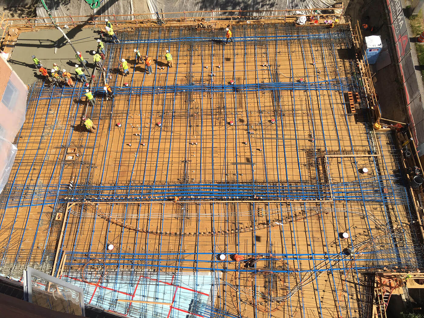 Construction workers laying concrete